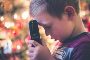 A child prays Lectio Divina.