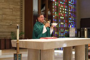 A Catholic priest performing the mass.