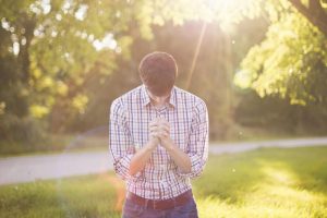 A jobseeker praying to find employment.