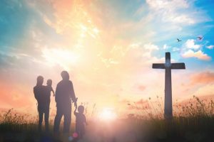 A Catholic family pursuing God and looking at the cross.