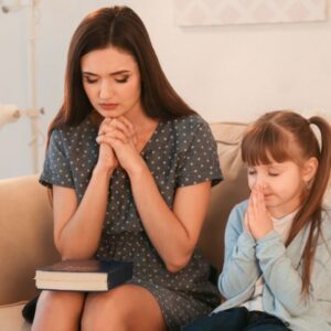 A mother teaching her daughter how to pray is one sign that she is a spiritual mother.