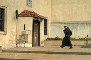 A Benedictine monk heading towards a chapel.