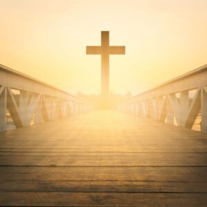 A Christian cross at the end of a walkway.