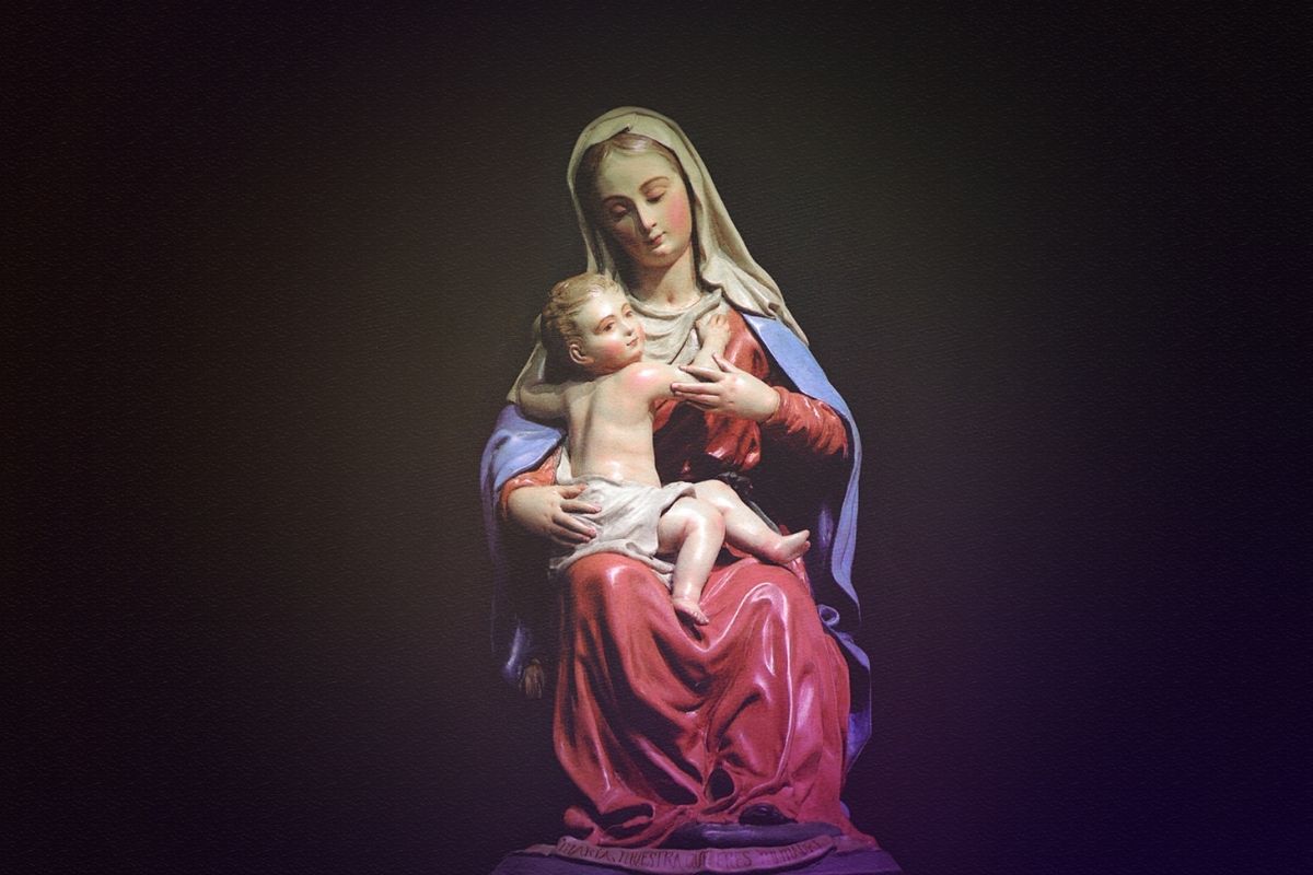 A statue of Mother Mary holding the baby Jesus.