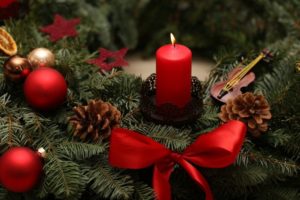 red candle and christmas balls