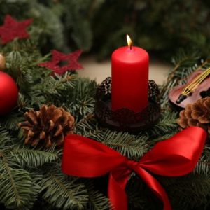 red candle and christmas balls