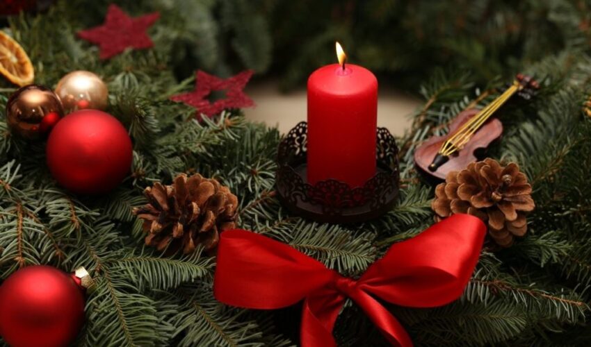 red candle and christmas balls