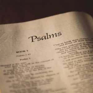 An open bible showing encouraging Psalm verses.