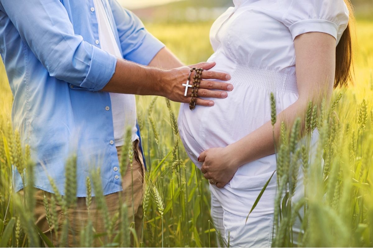 A pregnant couple excitedly waiting for the "fruits of the womb."