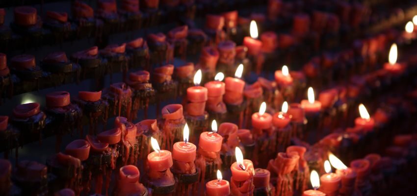 A row of Catholic prayer candles.
