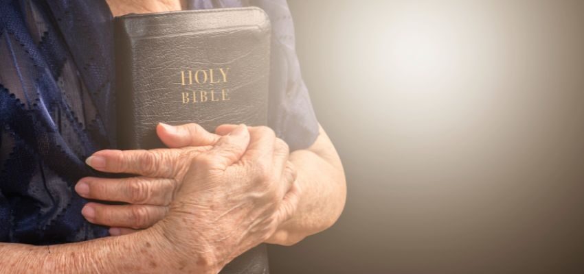 The man hugged the holy bible.