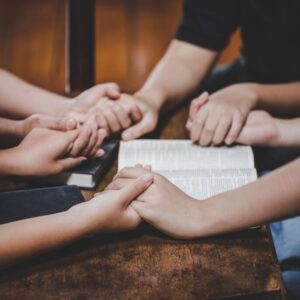 A group of people reads Psalms of bible verses to get some encouragement.