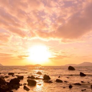 A view of the sunset on the beach.