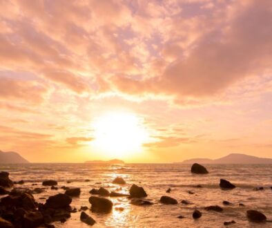 A view of the sunset on the beach.
