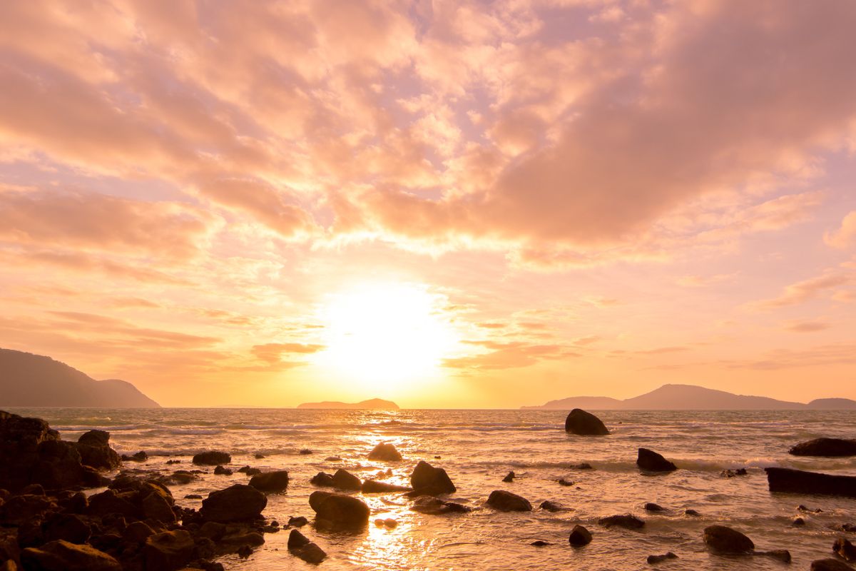 A view of the sunset on the beach.