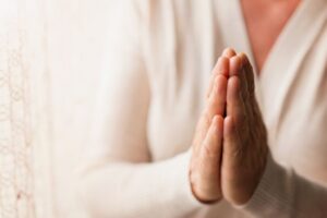 The woman prays to the patron saint of fertility.