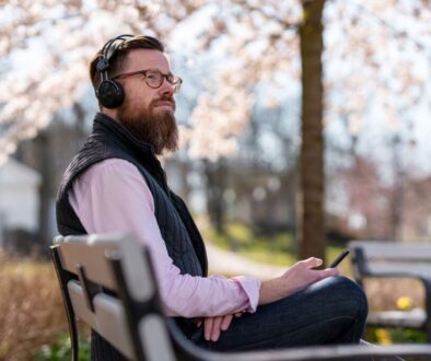 The man is listening to one of the famous Christian podcasts on Spotify.