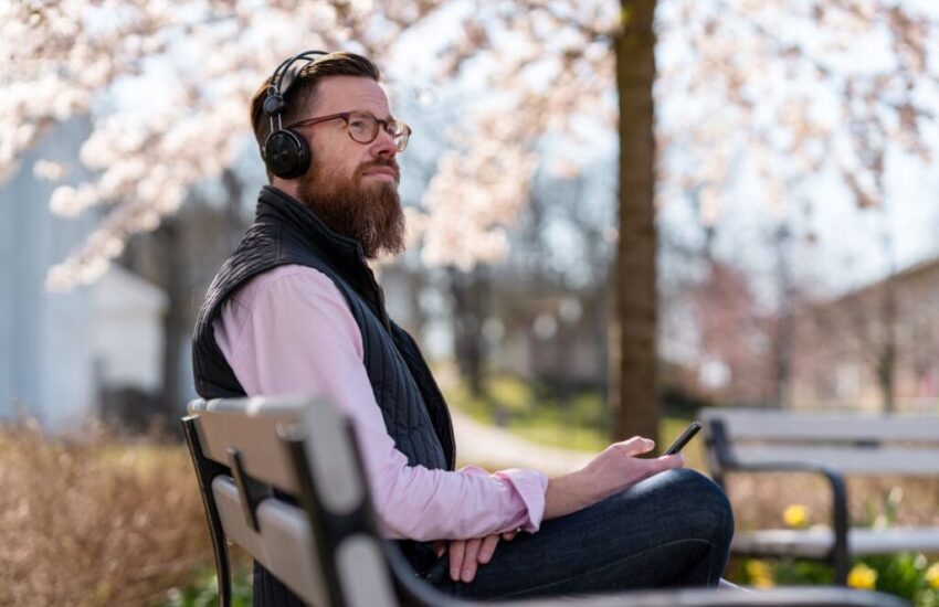 The man is listening to one of the famous Christian podcasts on Spotify.