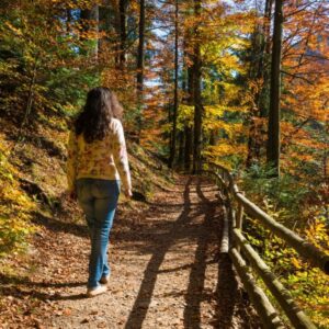 The woman is doing a prayer walk while surrounded by nature.