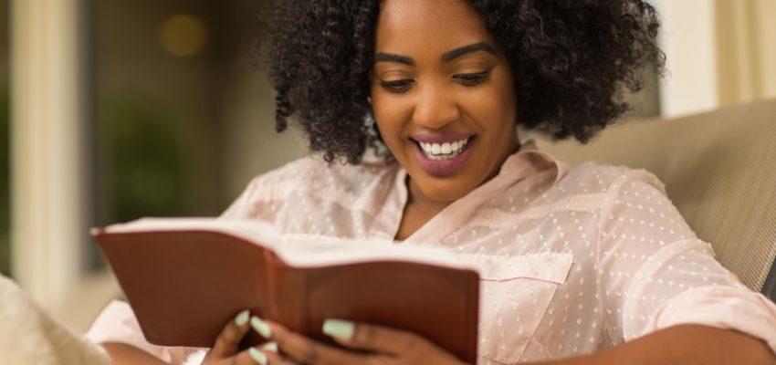 The woman is happy to join the best bible studies for women to strengthen his faith in God.