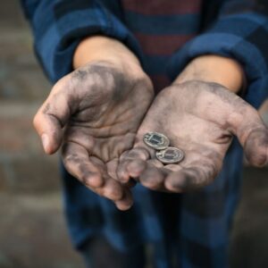 A poor widow holding two small coins.