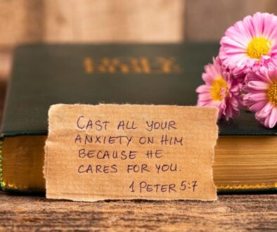 Holy Bible with handwritten 1 Peter 5:7 verse and flowers, a beautiful reminder for bible verse Sunday