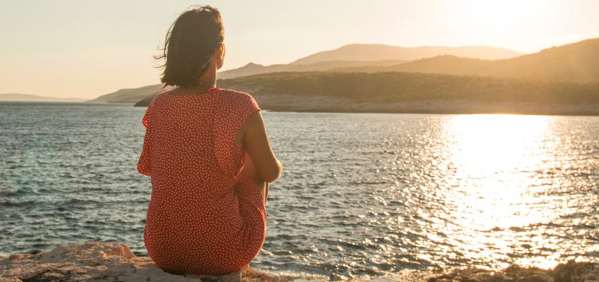 contemplative-practices2 Individual sitting quietly in nature, engaging in contemplative practices for self-awareness and inner peace.