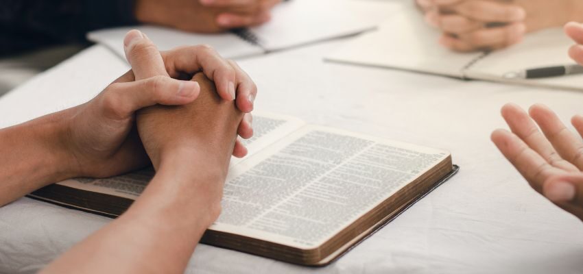 The Christian group reads the Bible together to help each other embrace faith despite fear.