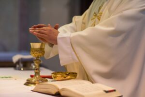 A Catholic priest consecrates the Eucharist.