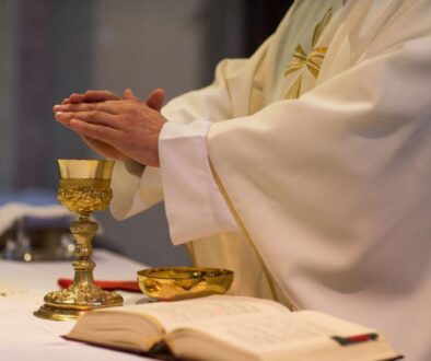 A Catholic priest consecrates the Eucharist.