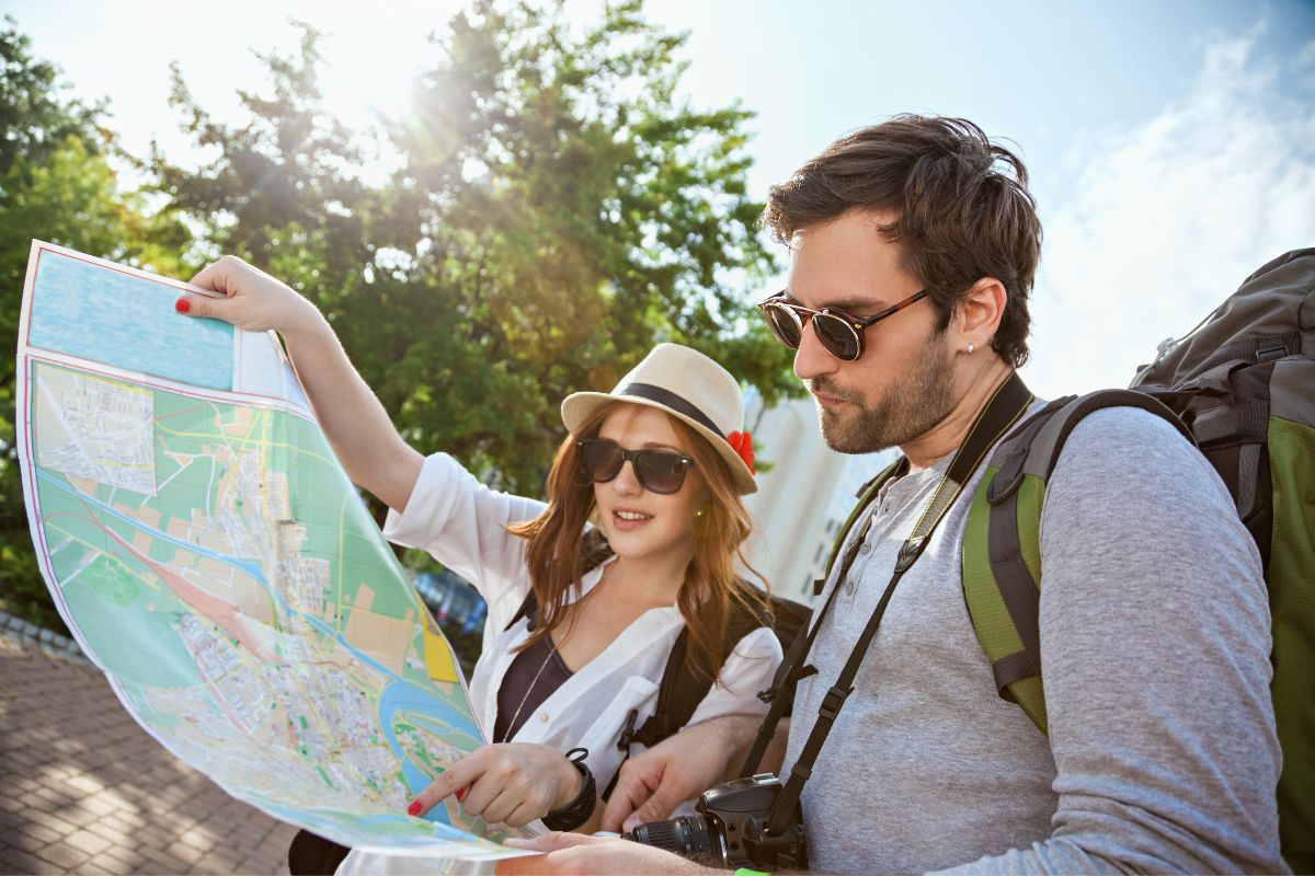 Tourists look at a map.