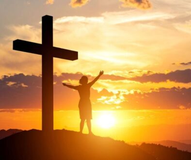 A Christian is cheering at the top of Mount Calvary.