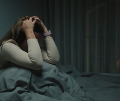 A woman awake at night, suffering from depression.