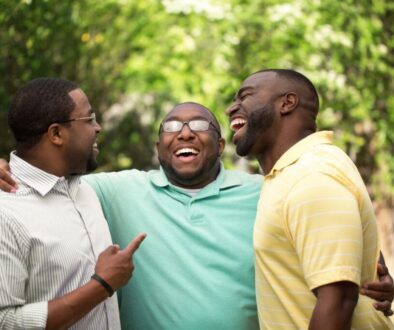A group of brothers laugh together.