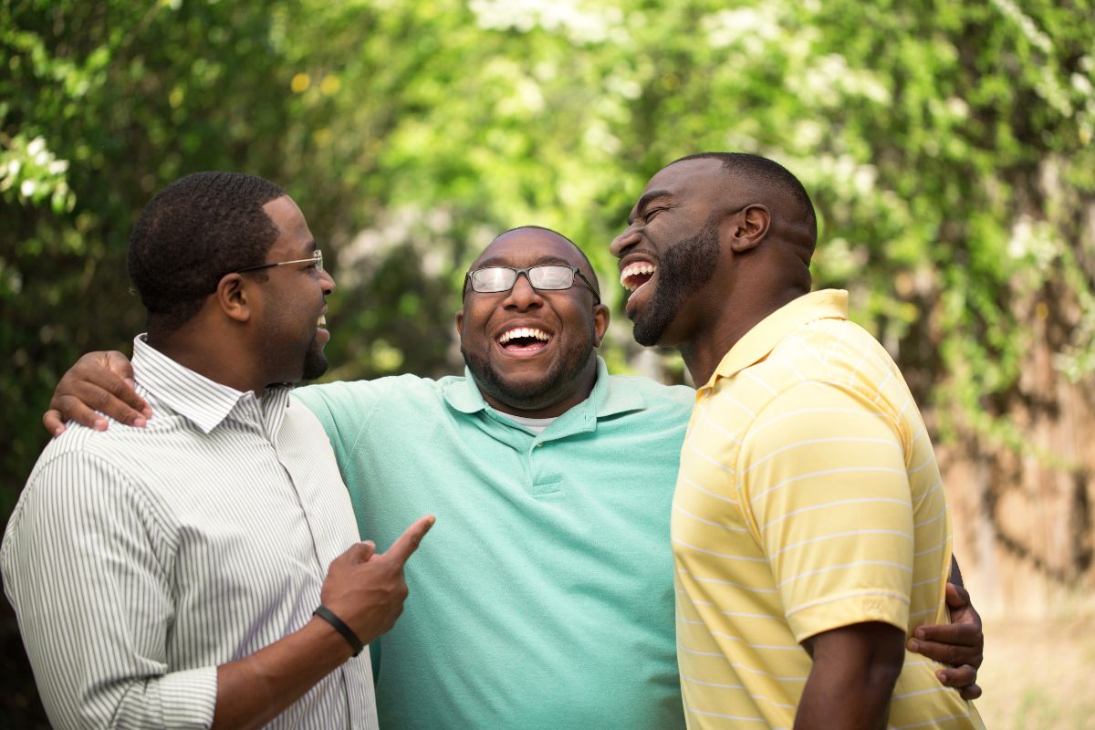 A group of brothers laugh together.
