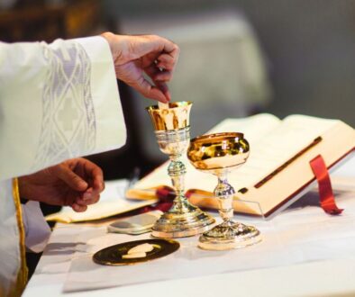 The priest prepared communion on the altar.