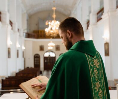 A Roman Catholic priest is dressed for mass.