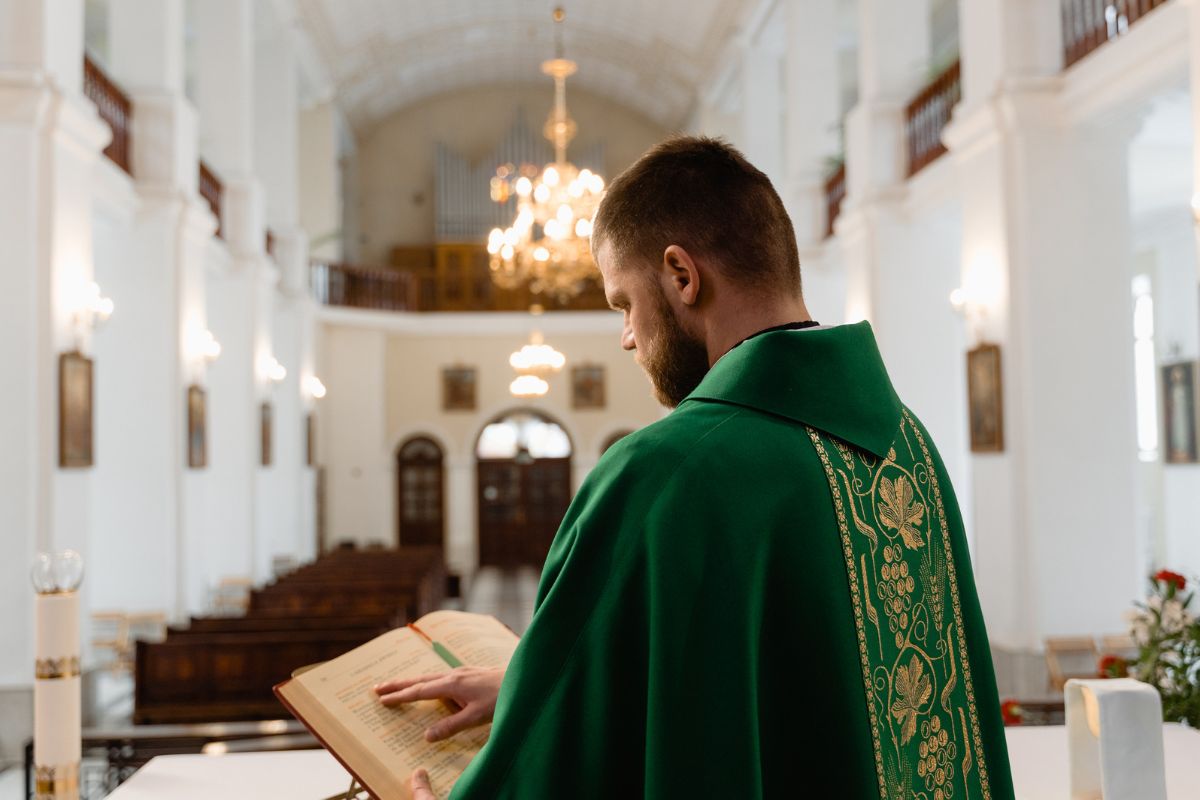 A Roman Catholic priest is dressed for mass.